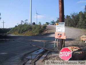 Access Control signs, construction trucks in background