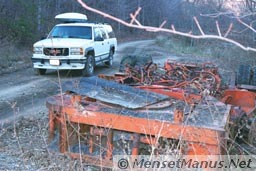 Mining equipment next to road - rear